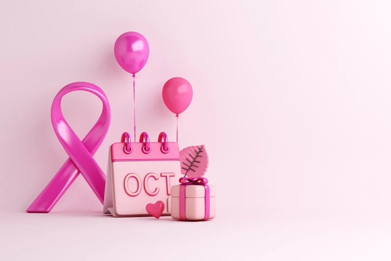 A pink ribbon is tied to a calendar displaying the month October, symbolising Breast Cancer Awareness Month.