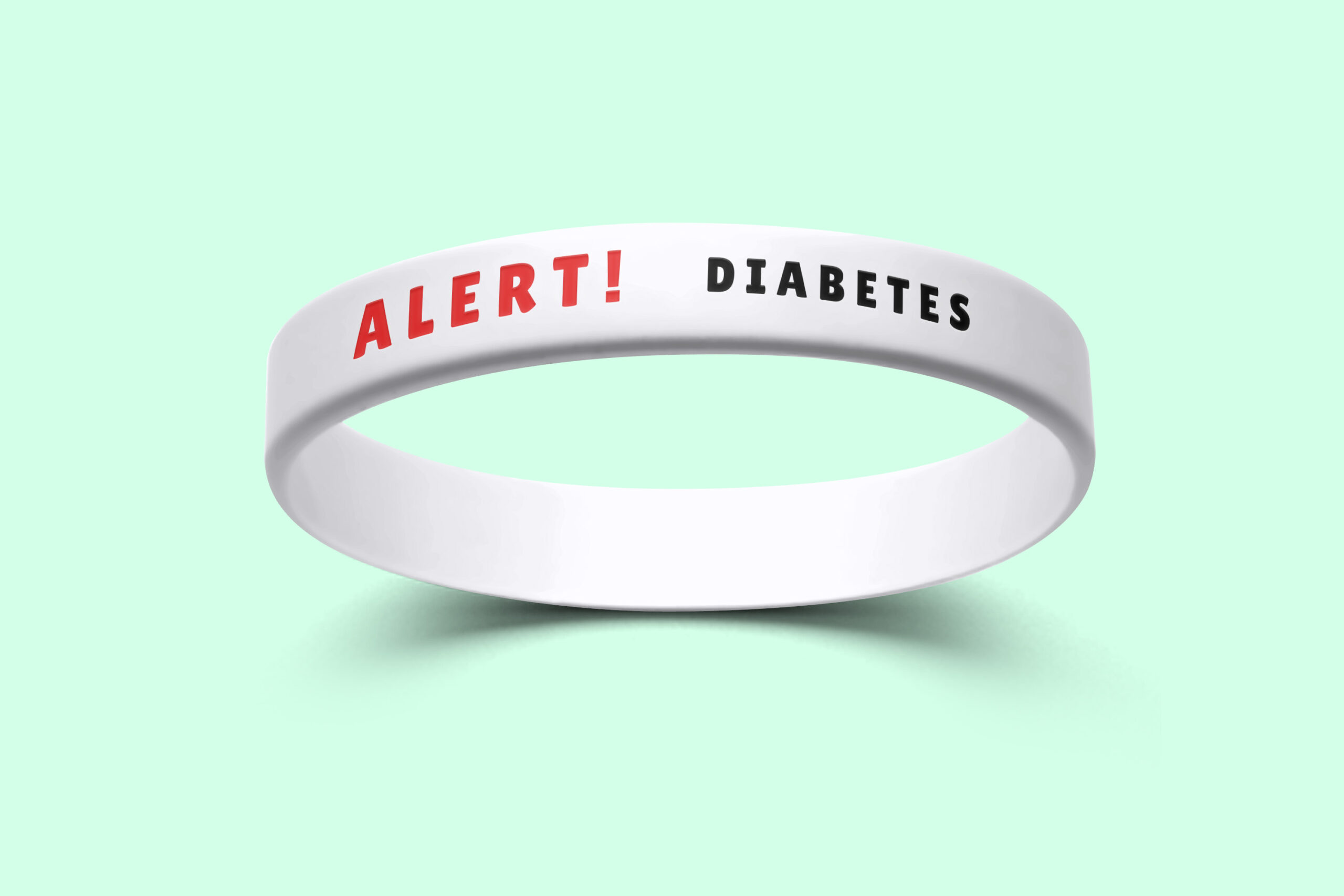 A white custom silicone wristband featuring the phrase "Alert! Diabetes" printed on it.